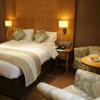 Bedroom at the Best Western Premier Yew Lodge East Midlands Airport hotel 
